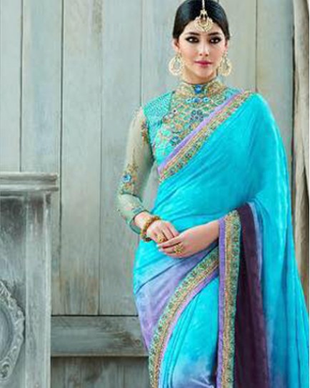 Heavy work with net blouse saree